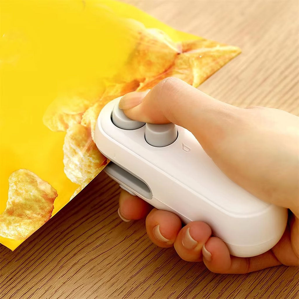 Rechargeable mini bag sealer sealing a snack bag